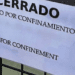 Imagen de archico de un cartel de 'cerrado por confinamiento'
