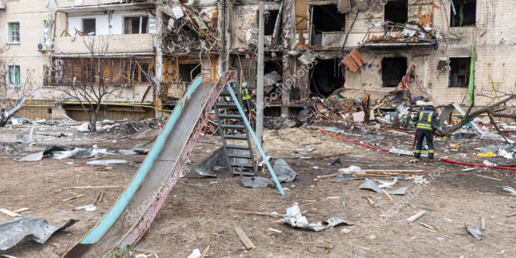 KYIV, UKRAINE - Feb. 25, 2022: War of Russia against Ukraine. A residential building damaged by an enemy aircraft in the Ukrainian capital Kyiv