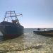 Pesquero usado como patera, embarrancado en la costa de Formentera.