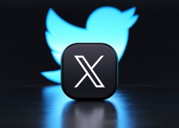 Valencia, Spain - July, 2023: X app logo in front of the Twitter blue bird symbol background in 3D rendering. X is the new name and logo of the social network Twitter owned by Elon Musk